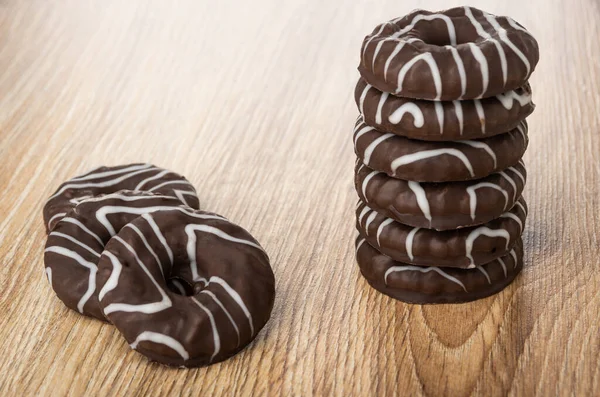 Stack of round cookies in chocolate, cookies on wooden table