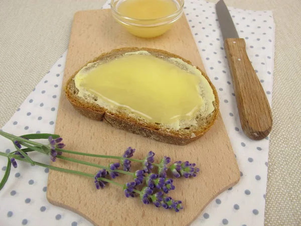 Butter bread with lavender honey — Stock Photo, Image