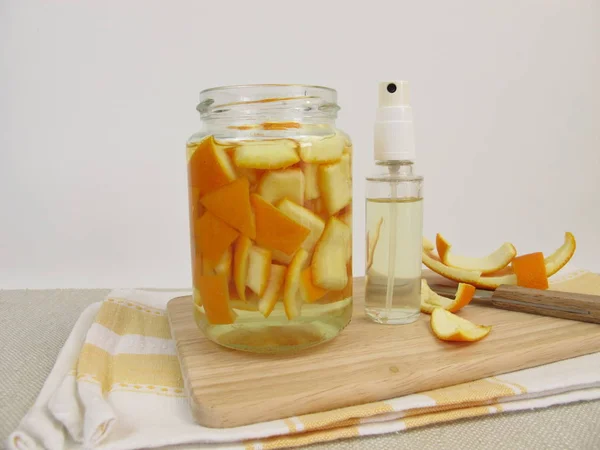 Organic household detergent with orange peel and vinegar in spray bottle — Stock Photo, Image