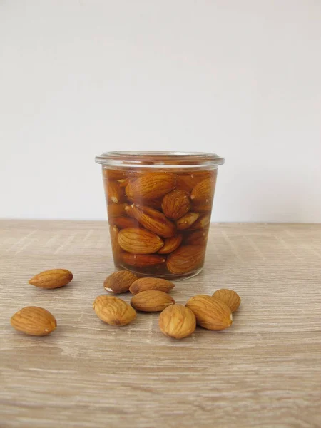 With water soaked and activated almonds — Stock Photo, Image