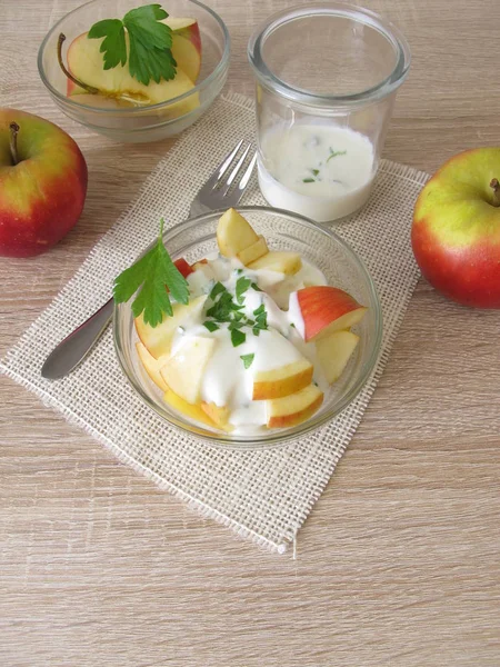 Fruit salad with apples and celery leaves in yogurt with apple vinegar — Stock Photo, Image