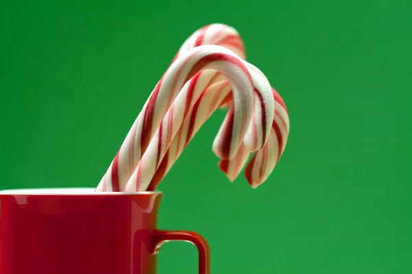 Lollipops in a mug — Stock Photo, Image