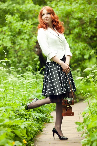 Woman with camera — Stock Photo, Image