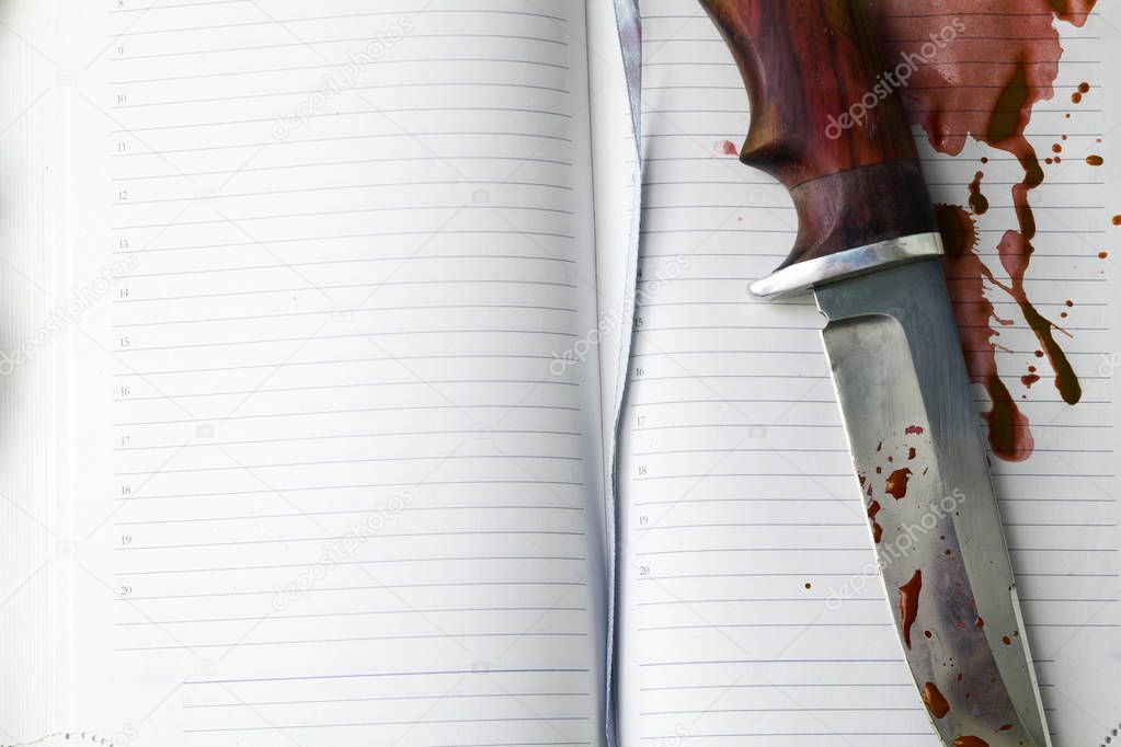 Knife and notebook