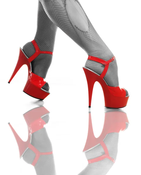 Red female high-heeled shoes on a white background — Stock Photo, Image