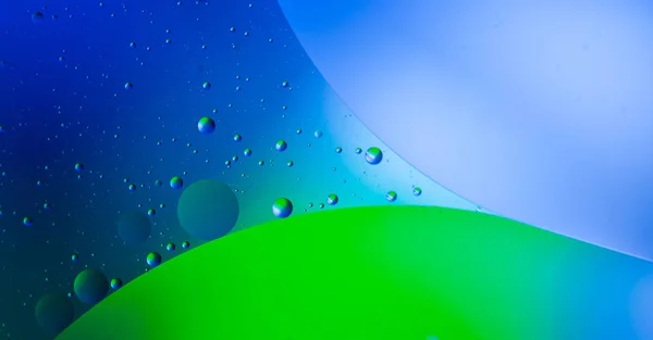 Abstract blue and green background with bubbles. Oil on the wate — 스톡 사진