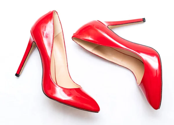 female shiny red stilettos on a white background