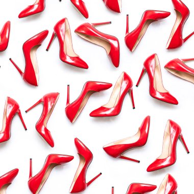 female shiny red stilettos on a white background
