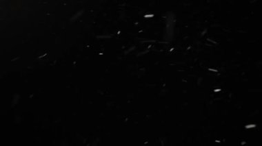 fast flying heavy snow at night. blizzard against the black sky