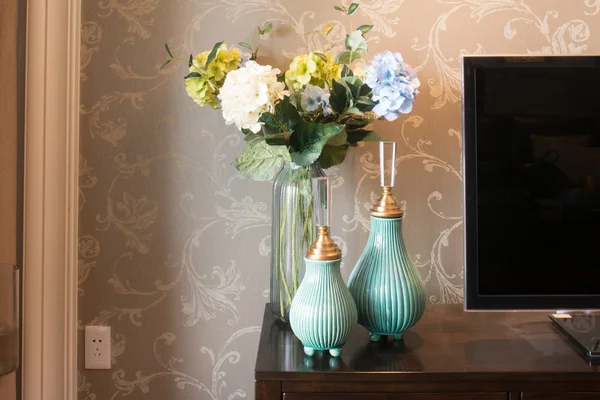 Beautiful vases near TV — Stock Photo, Image