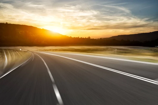 Sunrise from hill on view from rural road — Stock Photo, Image