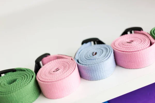 colorful belts in yoga room