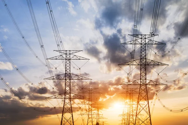 Power pylons in field — Stock Photo, Image