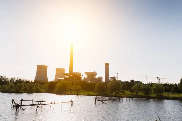 modern power plant near water