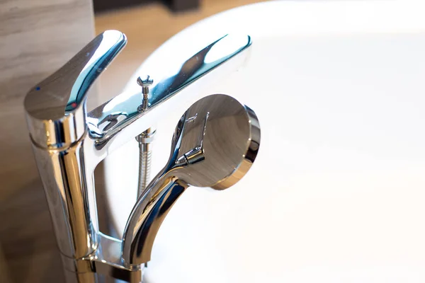 Elegant silver tap on white sink — Stock Photo, Image