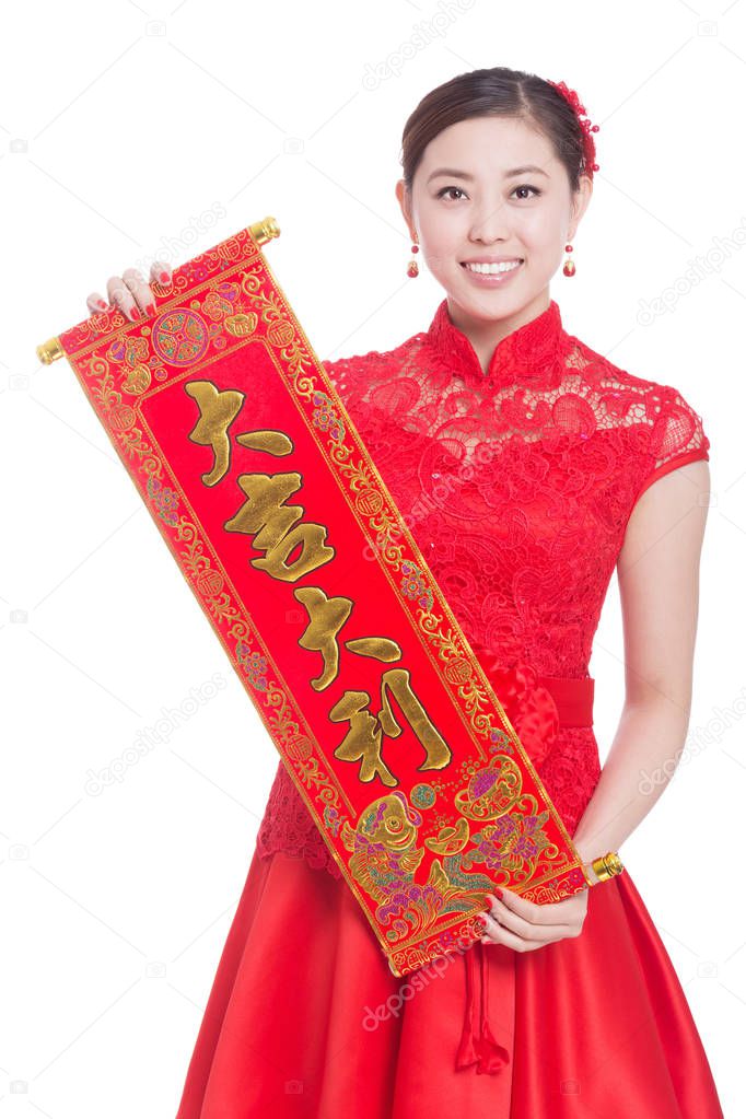 woman holds red couplet in chinese new year