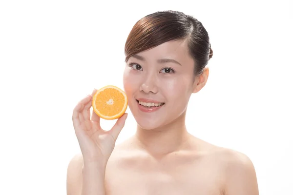Facial makeup of asian woman with orange — Stock Photo, Image
