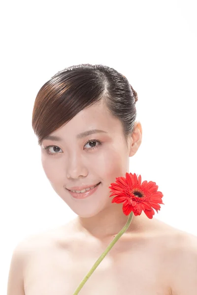 Maquillage facial de femme asiatique avec fleur — Photo