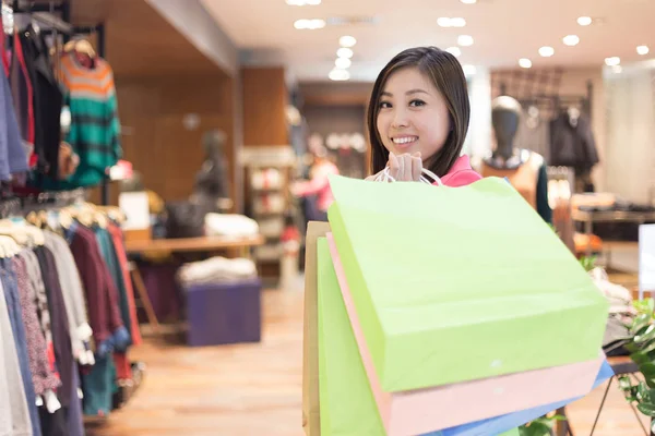 asian woman shopping in shopping mall