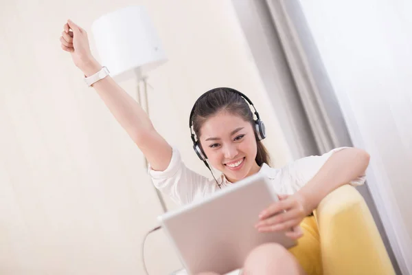 chinese woman listening music in room