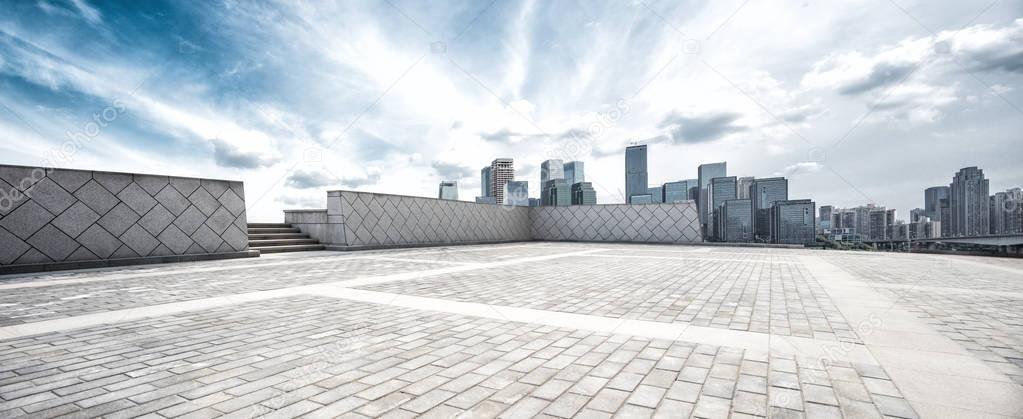 empty floor and skyline of modern city