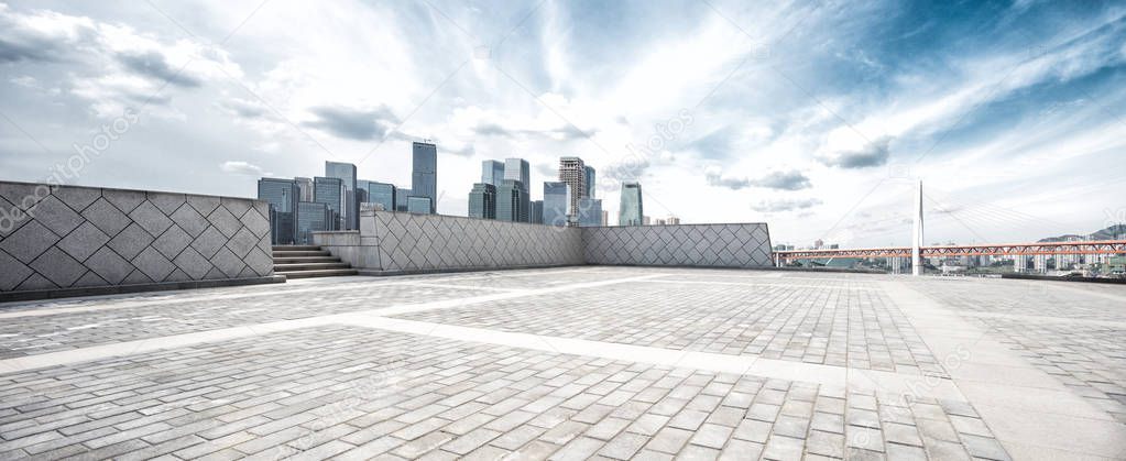 empty floor and skyline of modern city