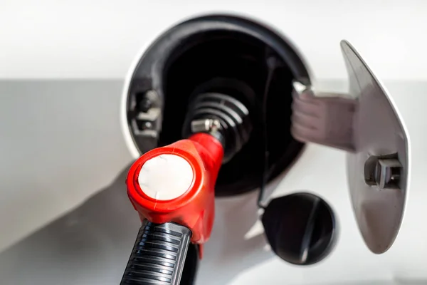 Petrol gun in car — Stock Photo, Image