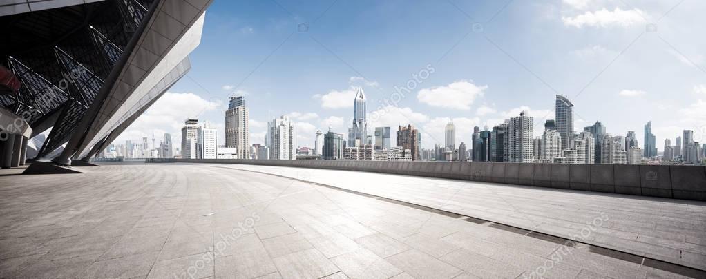 empty floor with modern cityscape and skyline 