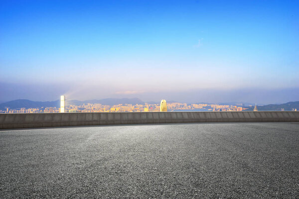 empty road with cityscape of modern city
