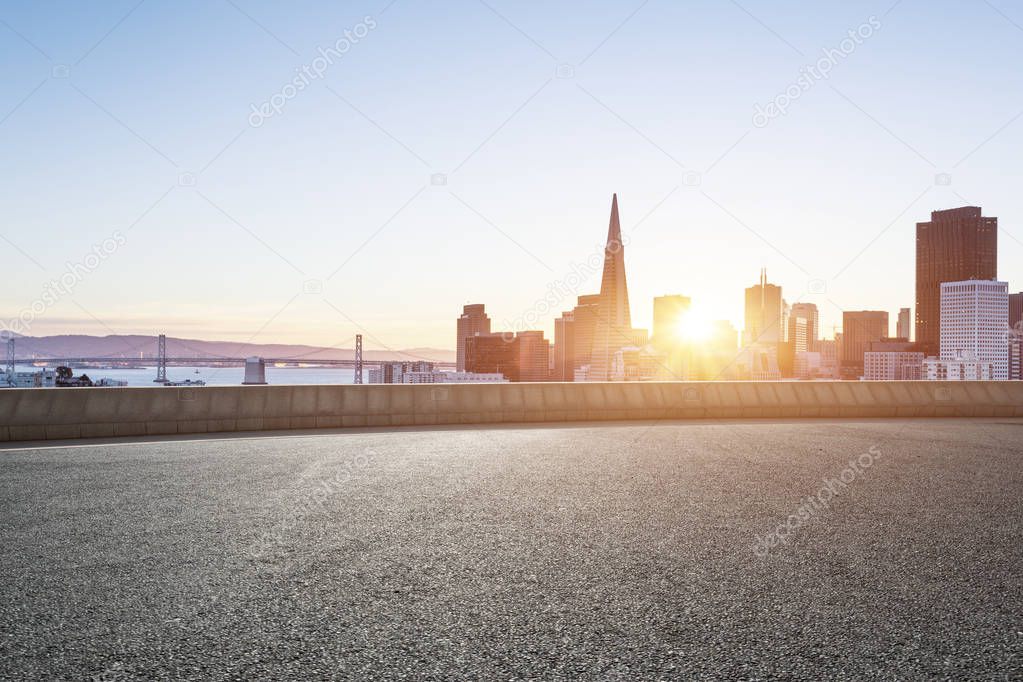 empty road with cityscape of modern city