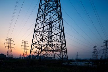 pylons in blue sky at sunrise clipart