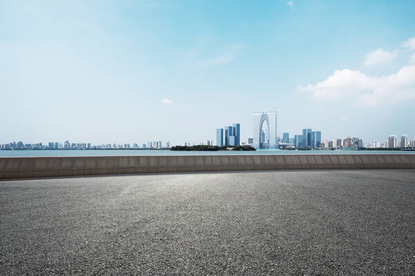 empty road with cityscape of modern city