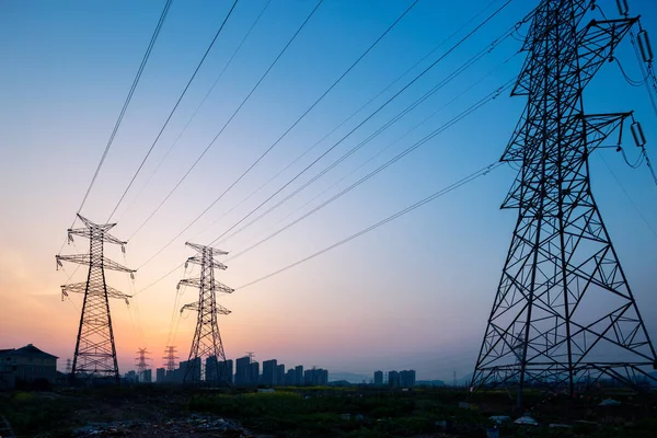 Pylons in blue sky at sunrise — Stock Photo, Image