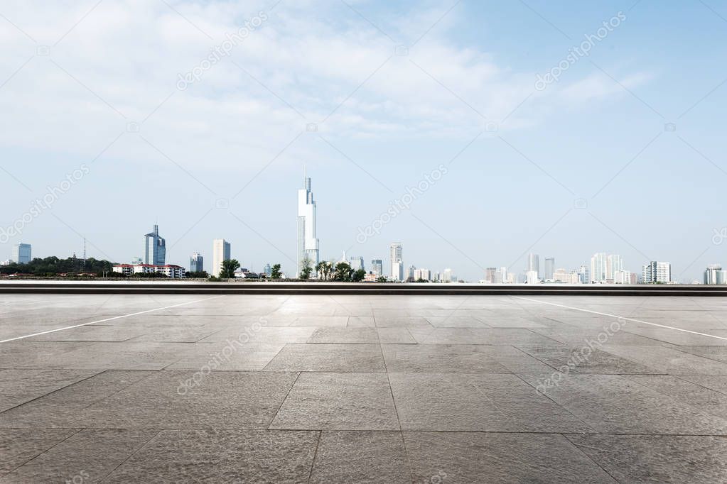 empty floor with cityscape of modern city