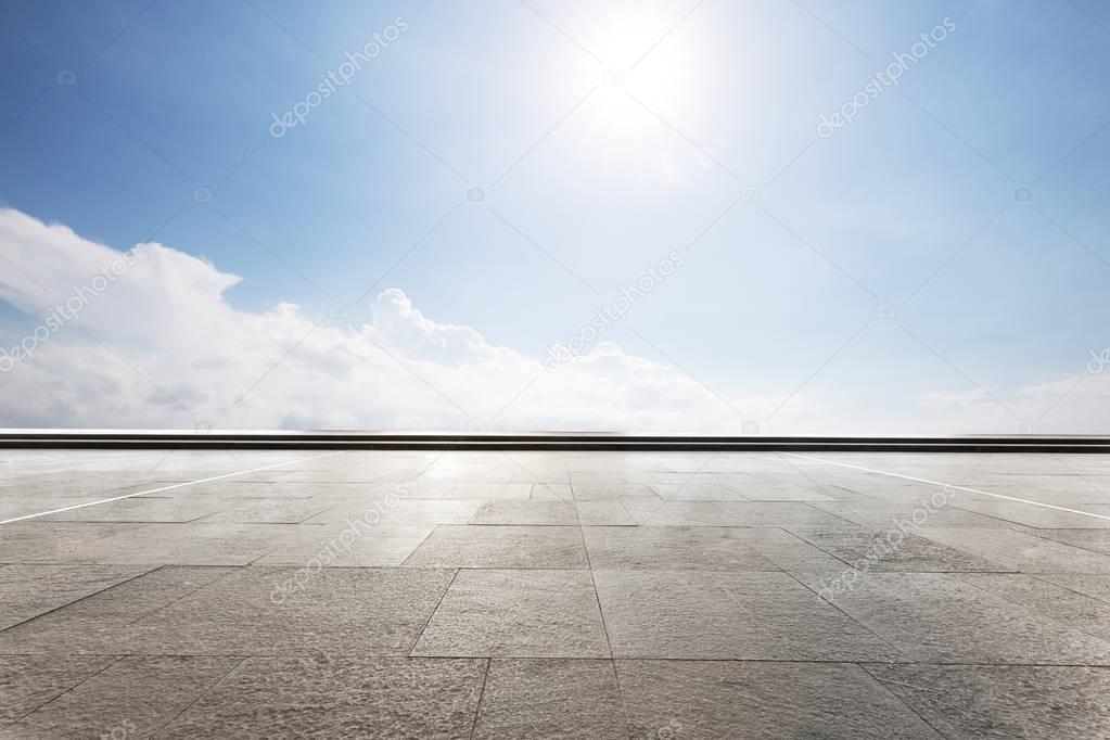 empty floor with blue sunny sky