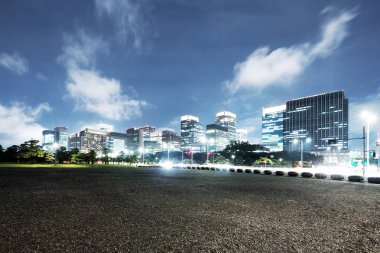 traffic on road in Tokyo at twilight clipart