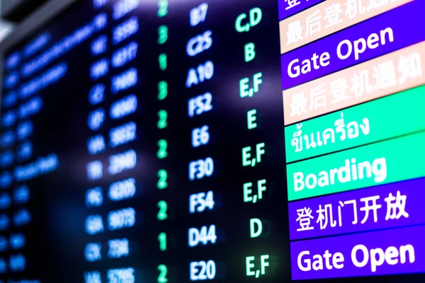 Screen with flight information in airport — Stock Photo, Image