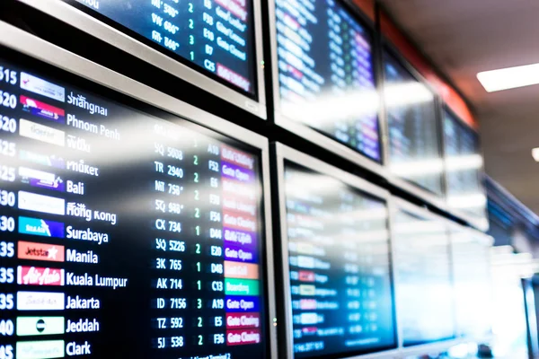Screen with flight information in airport — Stock Photo, Image