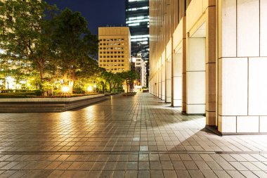 footpath outside of modern building at night clipart