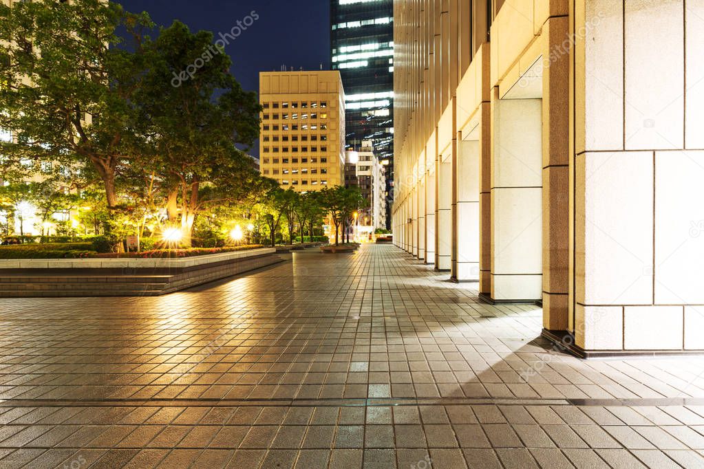 footpath outside of modern building at night