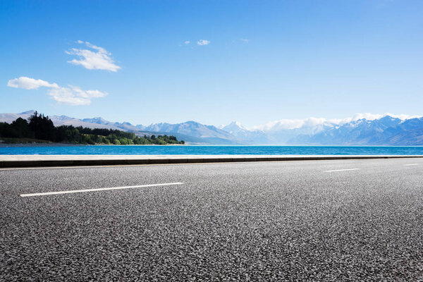 empty road with blue sea