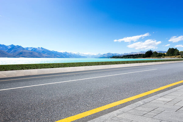 empty road with blue sea