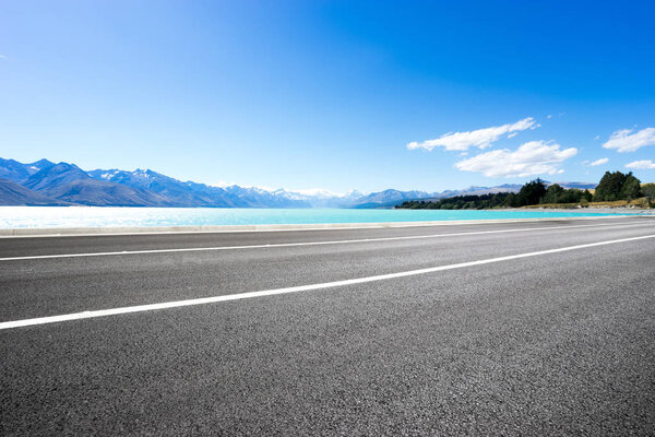 empty road with blue sea