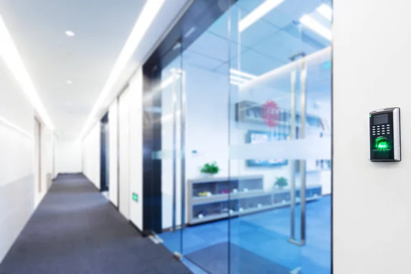 Fingerprint scanner on wall in modern corridor — Stock Photo, Image