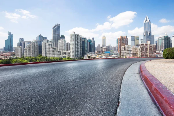 Empty road with modern city — Stock Photo, Image