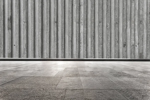 Bakstenen vloer met betonnen wand — Stockfoto