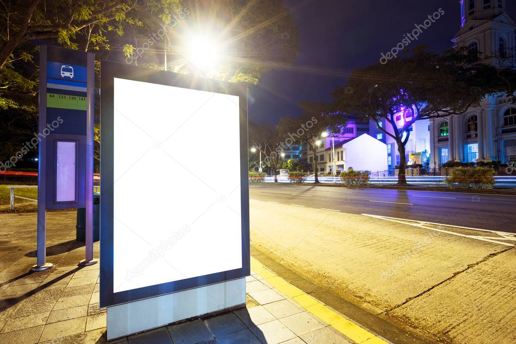 night scene of empty light box on street in modern city