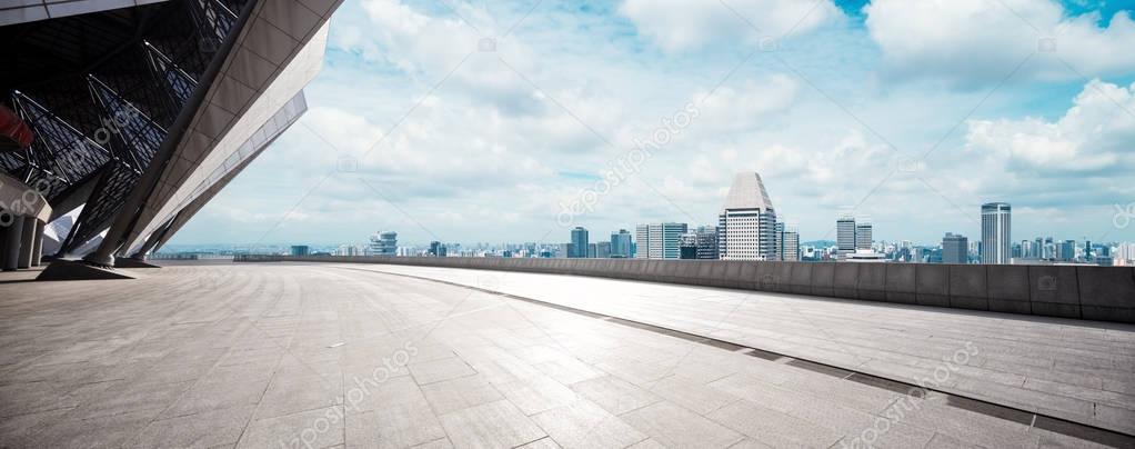 empty floor with cityscape of modern city