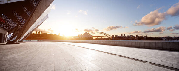 достопримечательность Сиднейский оперный театр и мост на восходе солнца из пустого кирпичного пола
