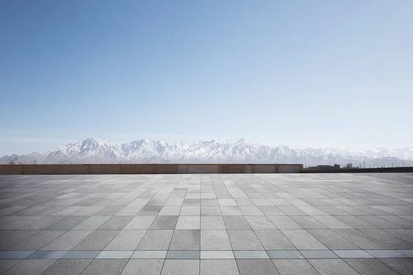 White Snow Mountains Empty Brick Floor Blue Sky — Stock Photo, Image